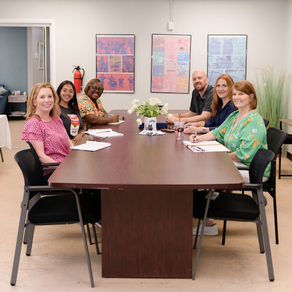 Staff at conference table